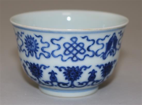 A Chinese blue and white Eight Buddhist emblems cup, bearing a Daoguang seal mark, diameter 7.3cm